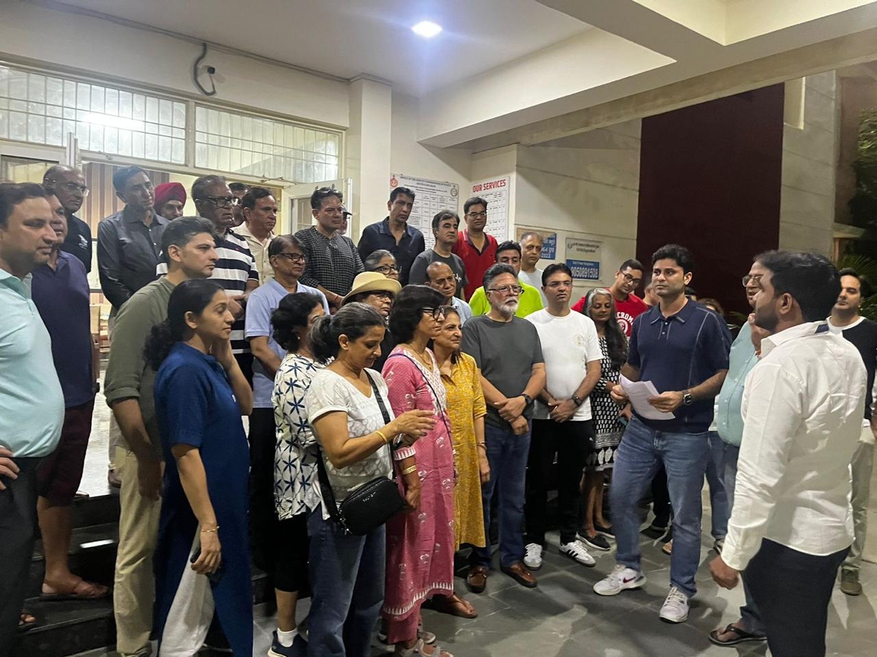 Residents came together carrying placards and banners to demand accountability, transparency, and strict legal compliance in the management of their community.