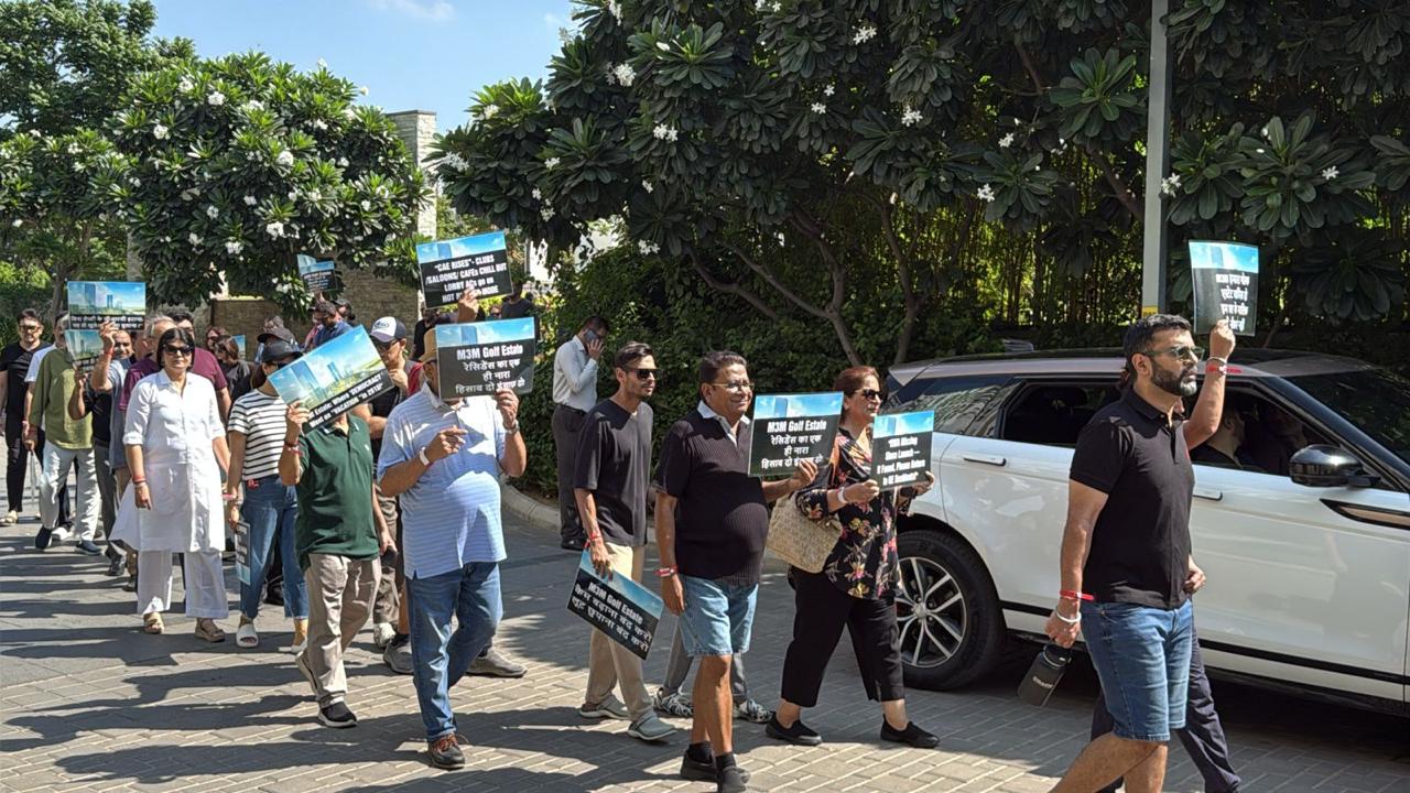 Residents came together carrying placards and banners to demand accountability, transparency, and strict legal compliance in the management of their community.