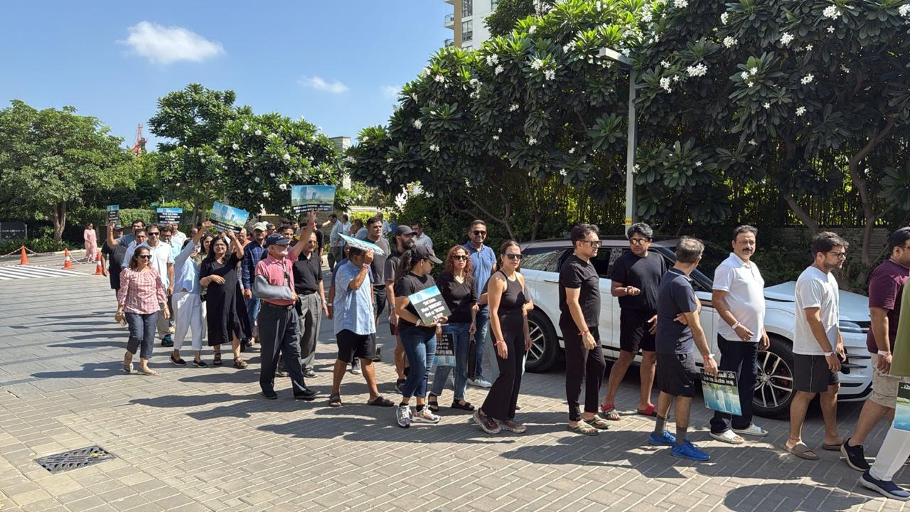 Residents came together carrying placards and banners to demand accountability, transparency, and strict legal compliance in the management of their community.