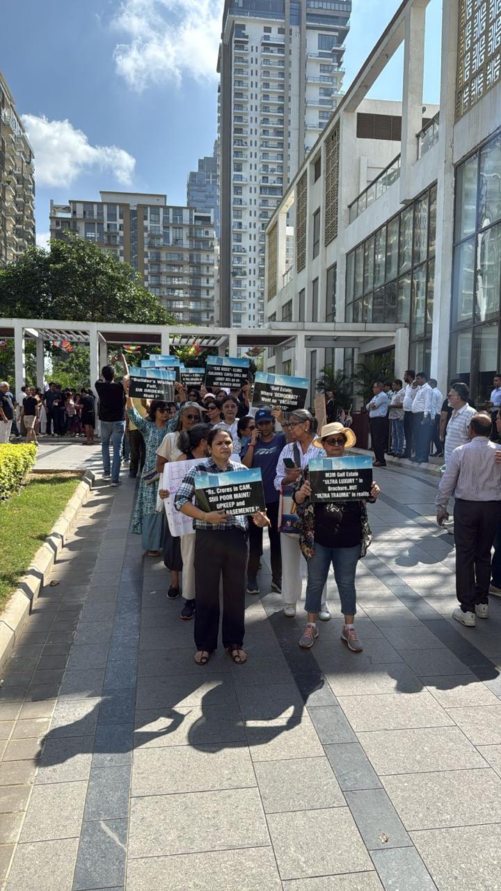 Residents came together carrying placards and banners to demand accountability, transparency, and strict legal compliance in the management of their community.